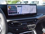 the dashboard of a car with a gps device in the center of it