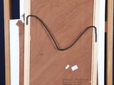 painting on easel with a piece of paper taped to the back of it