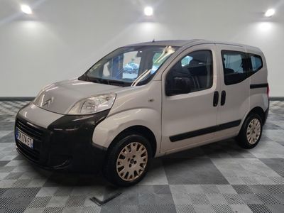 a picture of a small white van on a checkered floor