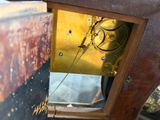 a close up of a clock that is on a table