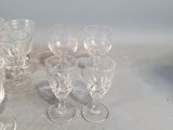 a lot of wine glasses sitting on a table