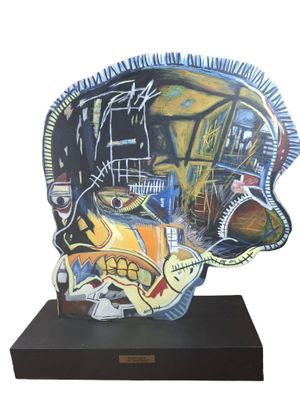 a sculpture of a fish that is on a black stand