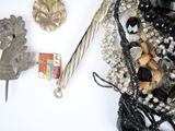 a bunch of jewelry that is laying out on a table