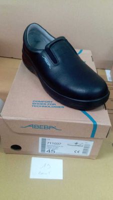 a black shoe that is on top of a box