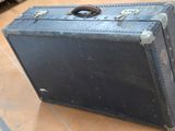 a black suitcase sitting on the floor in a room