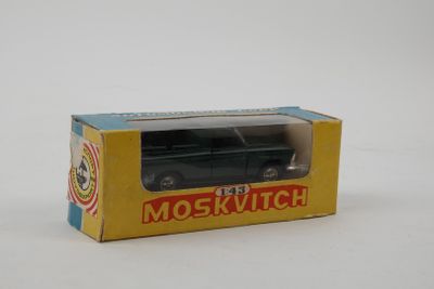 a box with a toy car in it on a white surface