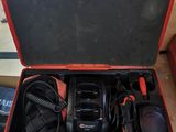 an open tool case with tools in it sitting on a table