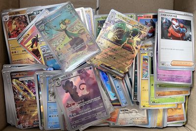 a box full of pokemon cards sitting on a table