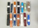 a lot of different colored watches on the table