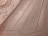 a pink vase that has a design on it