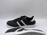 a pair of black and white sneakers on a white surface