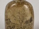 a small glass bottle with a painting on it