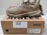 an image of a box with a pair of sneakers on top of it
