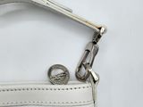 white leather purse with a metal clasp on a white background