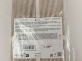 the back of a pair of beige socks in a plastic bag