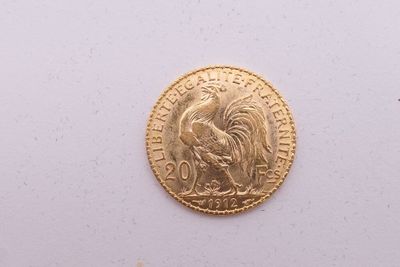 l'image d'une pièce d'or ornée d'un coq