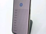 an image of a cell phone sitting on top of a stand