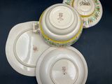 three plates and a bowl sitting on a table