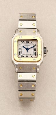 an image of a silver and gold wrist watch with roman numerals
