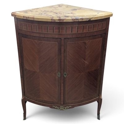 an image of a corner cabinet with a marble top