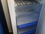 an open refrigerator with a lot of food inside of it