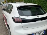 a white car that is parked on the side of the road