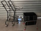 a cart that has a bunch of black plastic containers on it