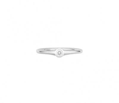 a close up of a diamond ring on a white background