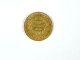 an image of a gold coin on a white surface