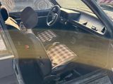 a car that has a plaid seat cover in it