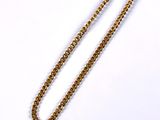 necklace with a gold chain and a gold pendant on a white background