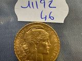 a close up of a gold coin with a note on it