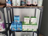a shelf that has many different types of vitamins on it