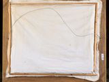 painting on an easel with a piece of paper on top of it