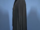 an image of a black shirt on a mannequin stand