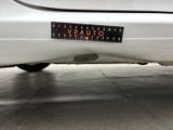 a sticker on the back of a white car