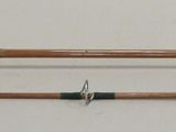 three different types of fishing rods on a white surface
