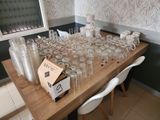 a table with a lot of empty glasses on it