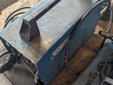 a machine that is sitting on a table in a workshop