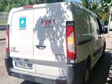 a white van that is parked on the side of the road