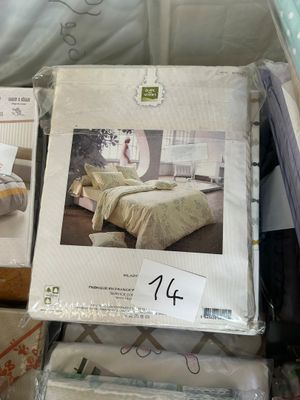 boxes of bedding are stacked on top of each other in a store