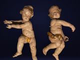 paire de figurines anciennes en porcelaine représentant un garçon et une fille