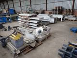 a large warehouse with a lot of metal items in it