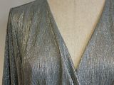 the back of a silver dress on a mannequin mannequin mannequin mannequin mannequin mannequin mannequin mannequin