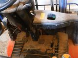 a close up of a forklift with a steering on it