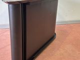 an image of a small desk with a black top