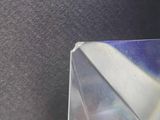 a clear box with a rainbow inside of it