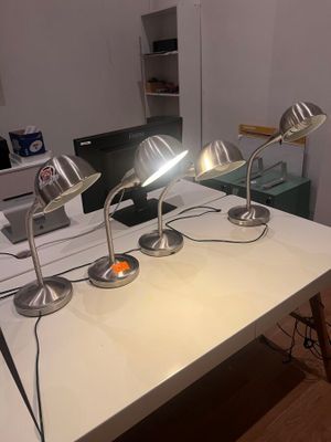 three lamps that are on a table in a room