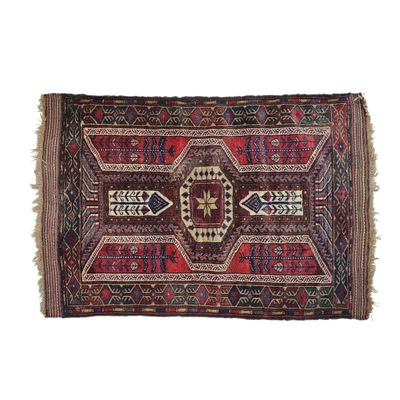 a red and blue rug on a white background