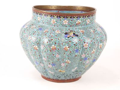 a blue vase with a bird on it on a white background